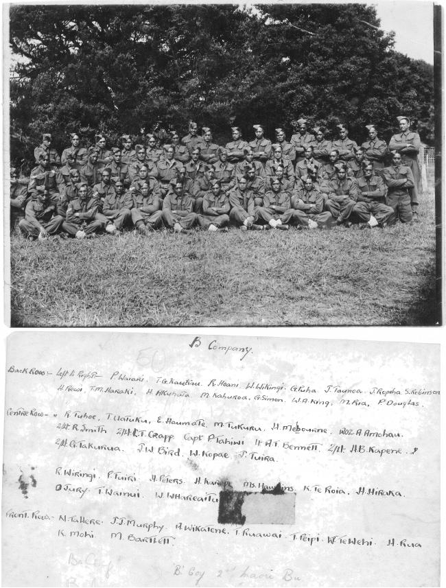 The front and back of the photograph. The photograph has 50 soliders in uniform standing in four rows, while the back of the photograph has their names listed.