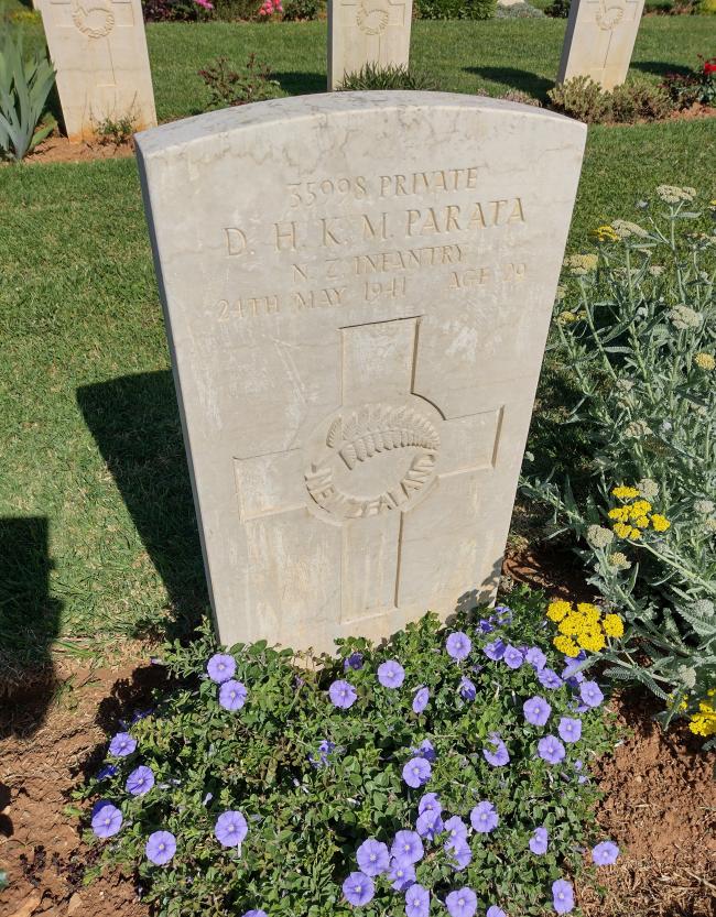 A headstone engraved with a fern
