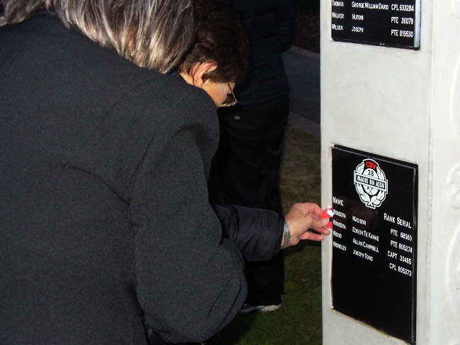 Laying a poppy at waharoa, Nelson 2011