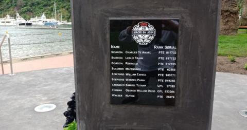 A plaque incribed with names in a concrete plinth