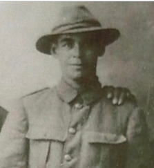 black and white portrait of a man in a New Zealand army uniform. 