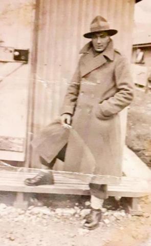 A soldier in a large overcoat