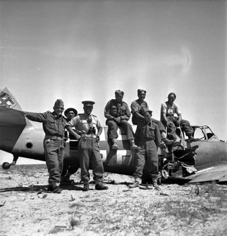 Posing with a crashed Messerschmitt 109