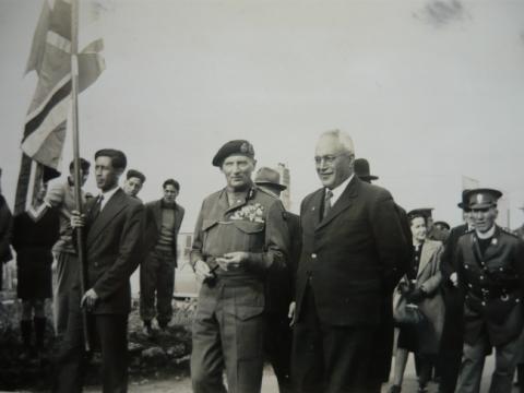 Monty taking a stroll with Ted  holding the flag..